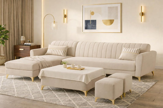 Adorn India Premium Luster 8 Seater L Shape Sofa Set with 2 Puffy & 1 Center Table | Velvet Suede Fabric | 3-Year Warranty | LHS | Cream with Golden Legs & Striped Pattern Cushion